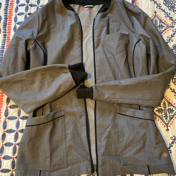 white cross scrub jacket